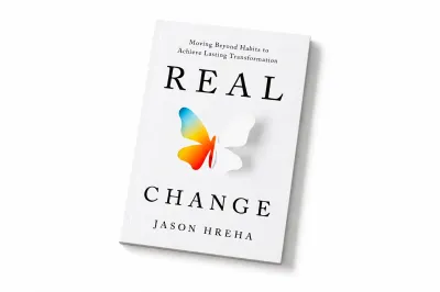 Real Change by Jason Hreha, with a colorful butterfly on its white cover.